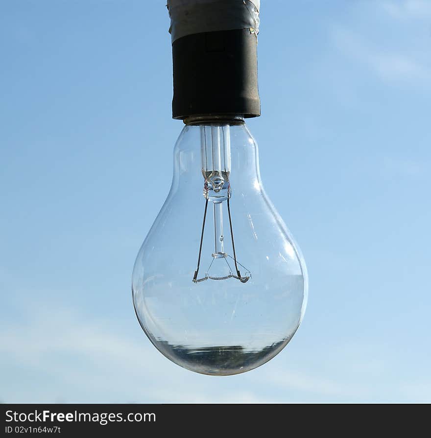 Electric lamp on a background of blue sky