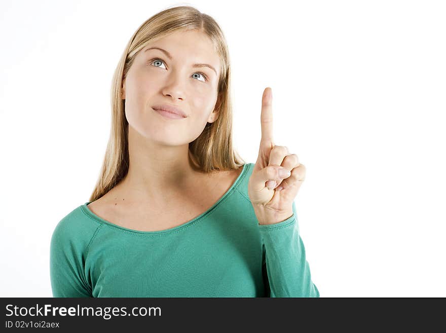 Young woman pointing at something, isolated on white