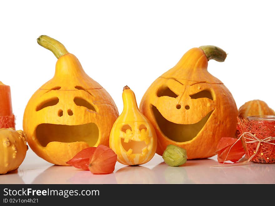 Halloween pumpkins with funny faces on white. Halloween pumpkins with funny faces on white