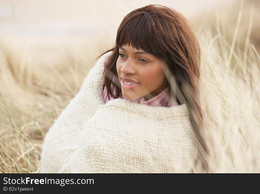 Woman Wrapped In Blanket Amongst Dunes On Winter B