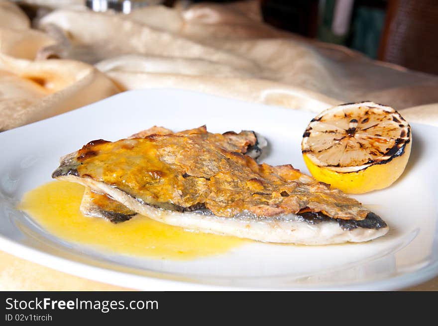 Grilled fish with lemon and chili sauce. Grilled fish with lemon and chili sauce