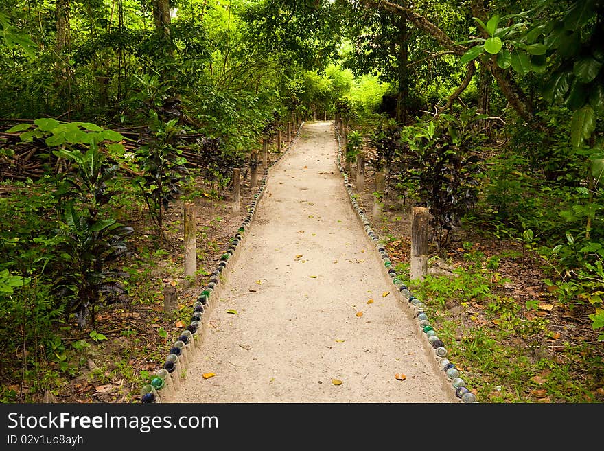 Path lined with bottles at a resort on Havelock Island, Andaman and Nicobar Islands, India. Path lined with bottles at a resort on Havelock Island, Andaman and Nicobar Islands, India.