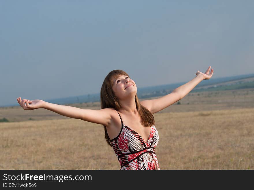 Young smiling, happy, the girl has thrown up hands upwards. Young smiling, happy, the girl has thrown up hands upwards.