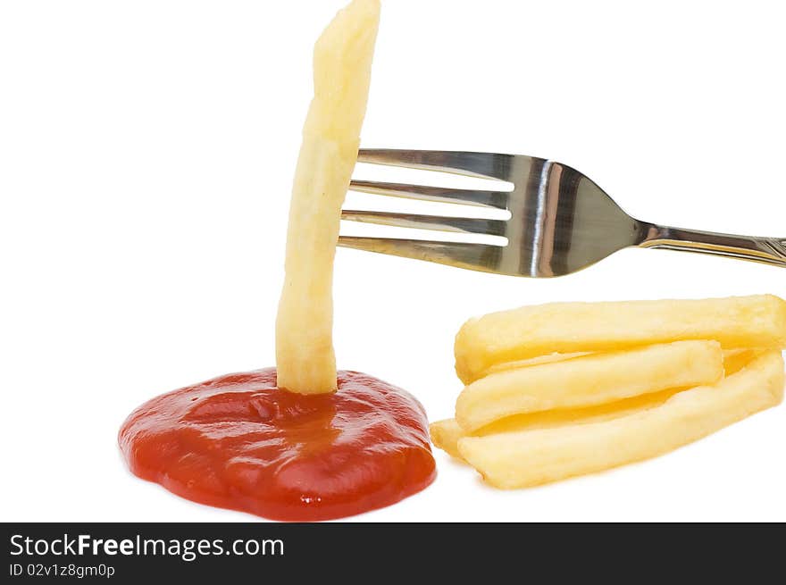 Fried chipped potato on a fork isolated over white. Fried chipped potato on a fork isolated over white