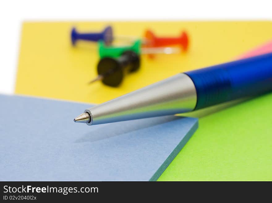 Pen and note isolated on white background still life