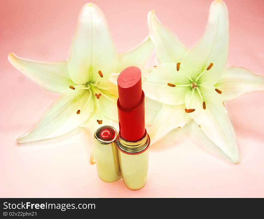 Red Lipstick With Lilies On Background