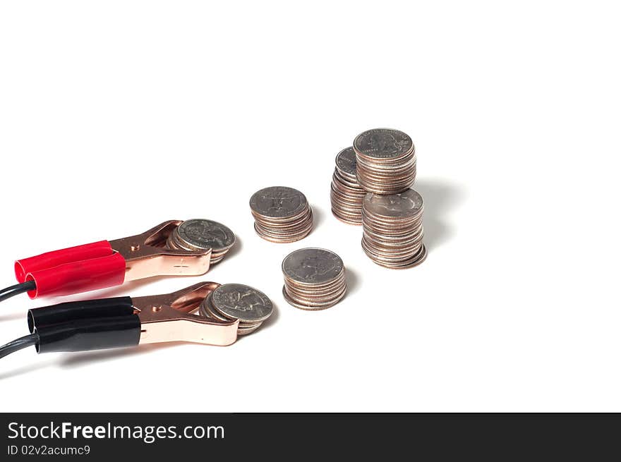 Concept of jump starting a savings program,with coins and jumper cables isolated on white. Concept of jump starting a savings program,with coins and jumper cables isolated on white.