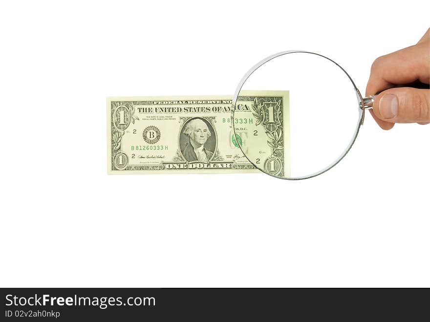 Dollar bill and hand holding magnifying glass