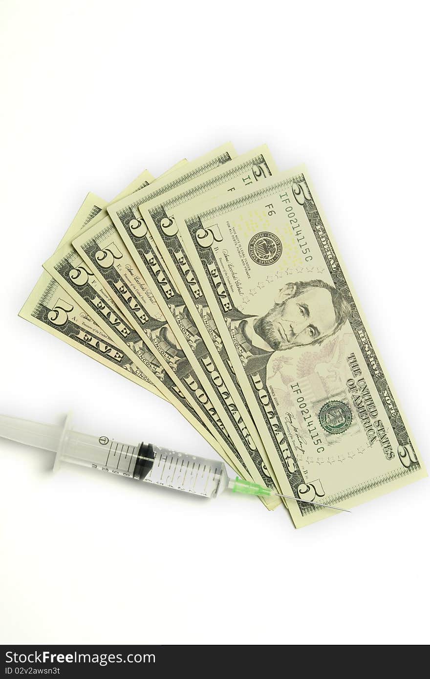 Five dollar bills and syringe isolated on white background