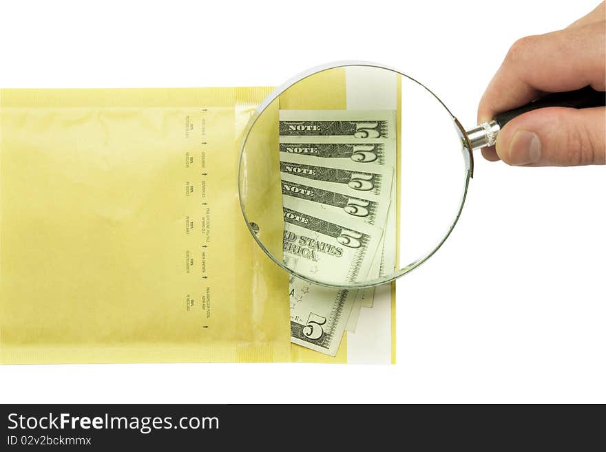 Dollars in the envelope and hand holding magnifying glass isolated on white background