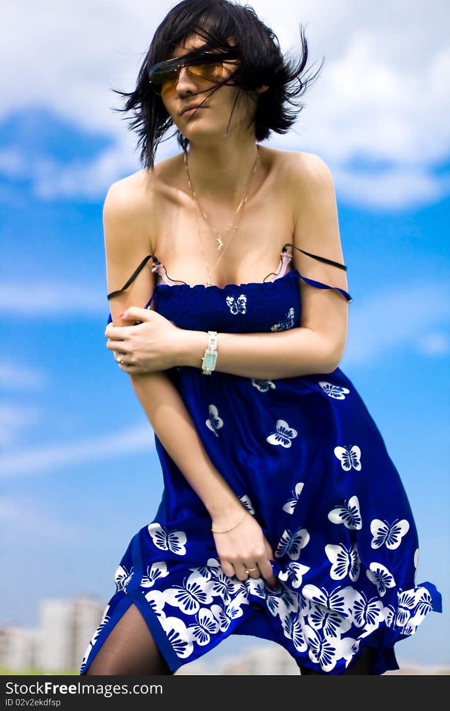 Summer girl against a background of blue sky. Summer girl against a background of blue sky