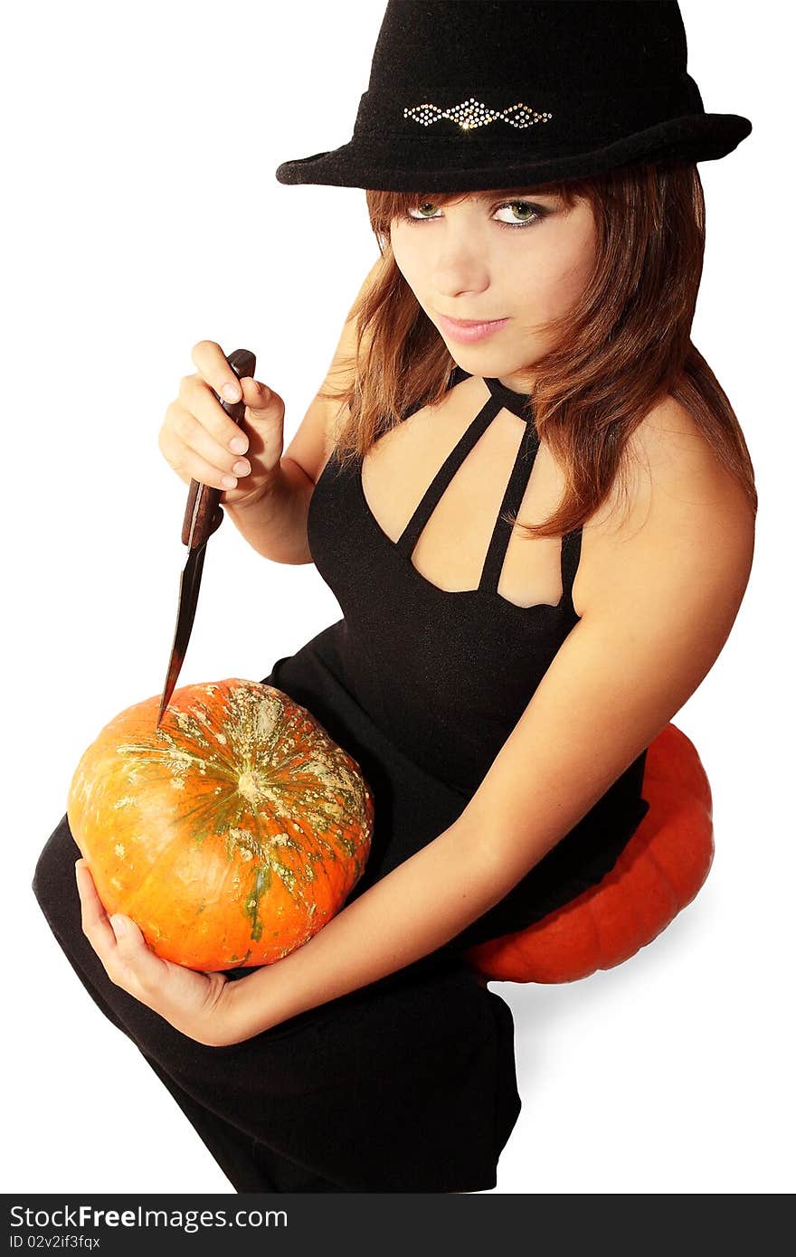 Witch holds in the hands pumpkin and knife. Witch holds in the hands pumpkin and knife