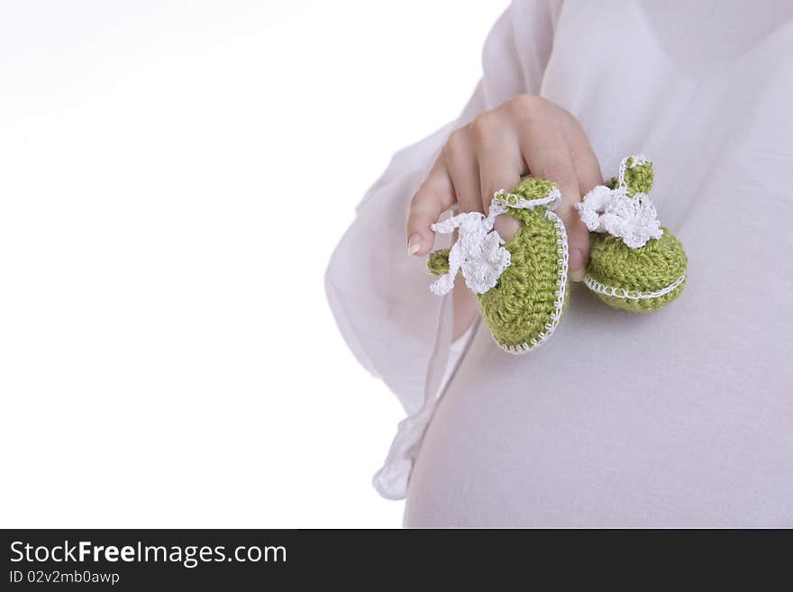 Baby Shoes, children's shoes, white background, booties, crocheted booties, booties olive, white shirt, pregnancy, mom, mother's hands, olive