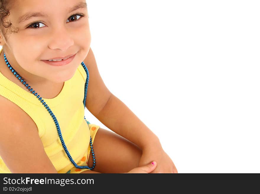 Adorable 3 year old hispanic african american girl sitting on stool over white background. Adorable 3 year old hispanic african american girl sitting on stool over white background.