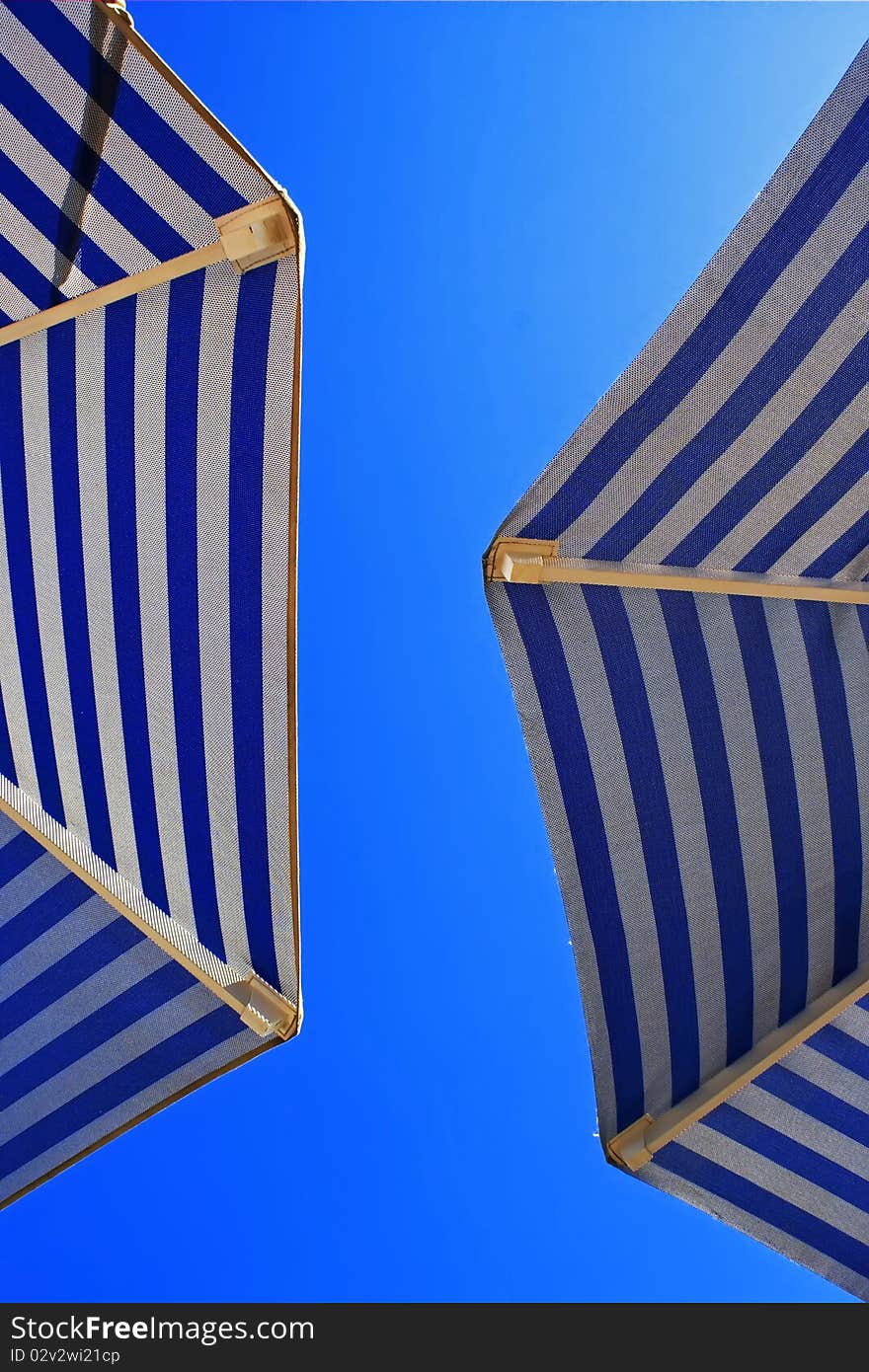 Sunshades against the blue sky