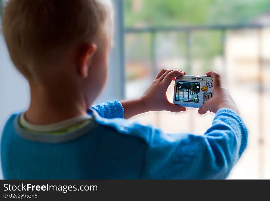 The Child Is Making A Photo