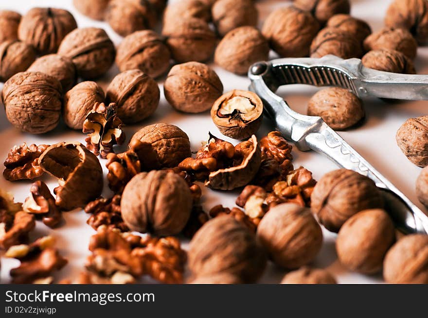 Nutcracker with walnut on a white background. Nutcracker with walnut on a white background