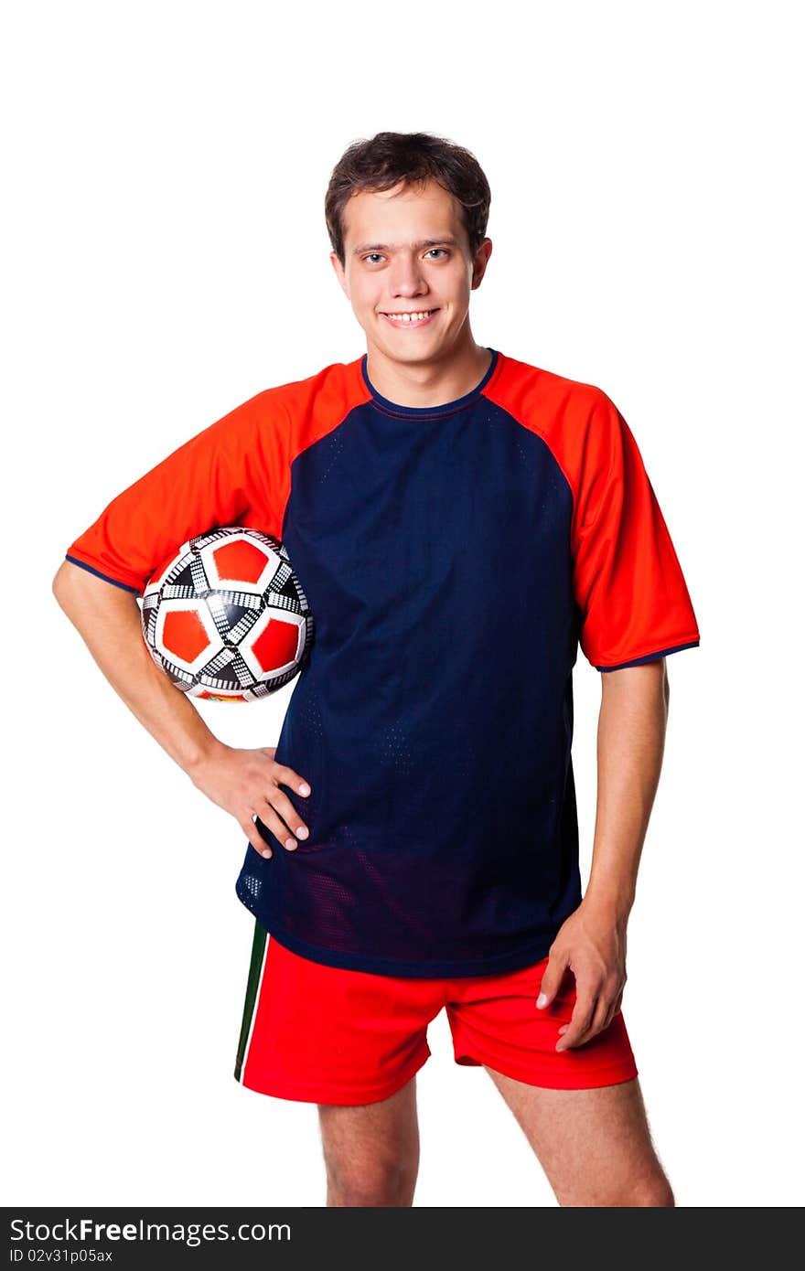 Football player in red clothes with ball in studio. isolated on white bakcground