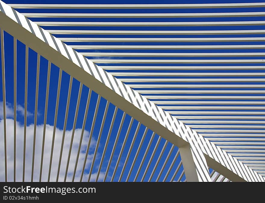 White lines and angles in front of the Sky (roof in a public park in Spain)