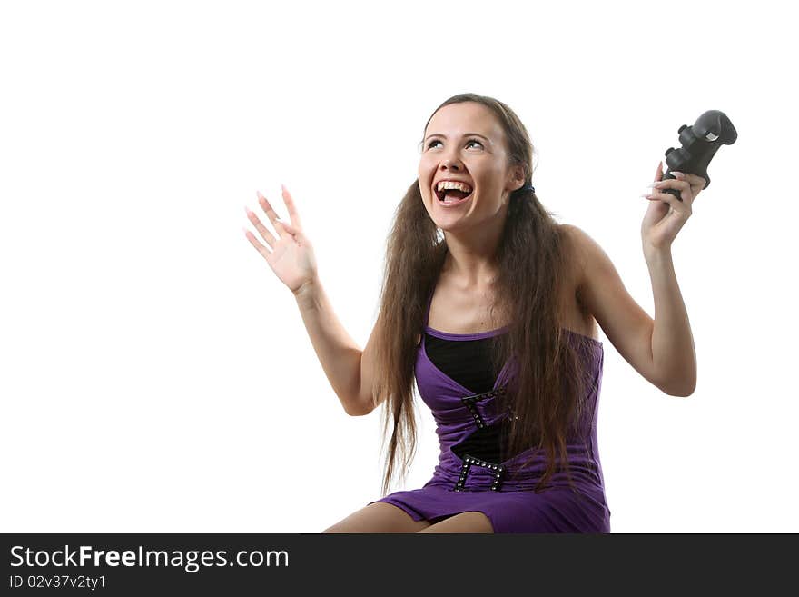 Young women play wideogame by gamepad on the white isolated background. Young women play wideogame by gamepad on the white isolated background