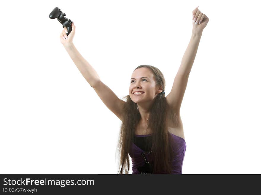 Young women play wideogame by gamepad on the white isolated background. Young women play wideogame by gamepad on the white isolated background