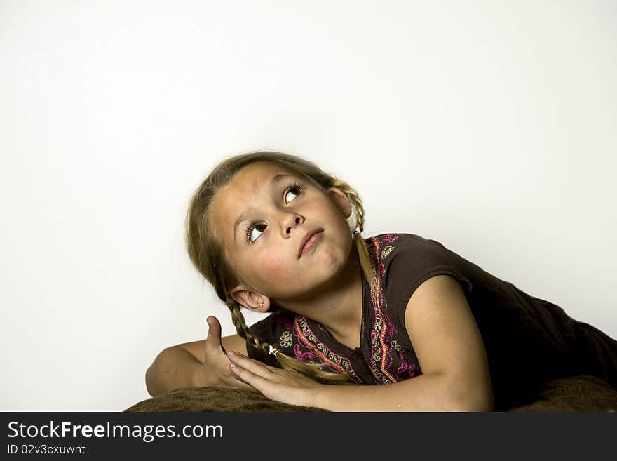 Beautiful young girl looking up over her shoulder