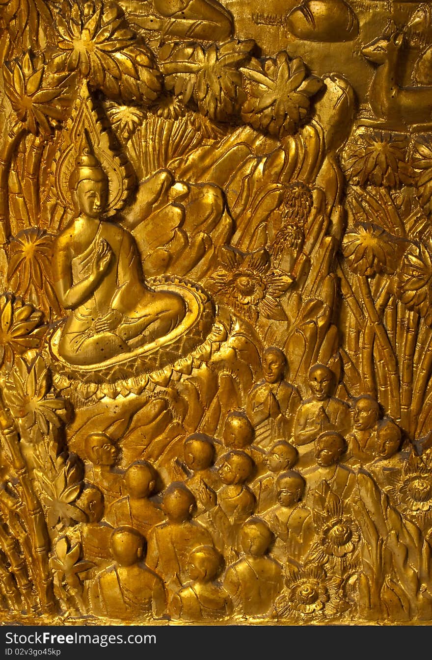 Buddha carved gold paint on church door