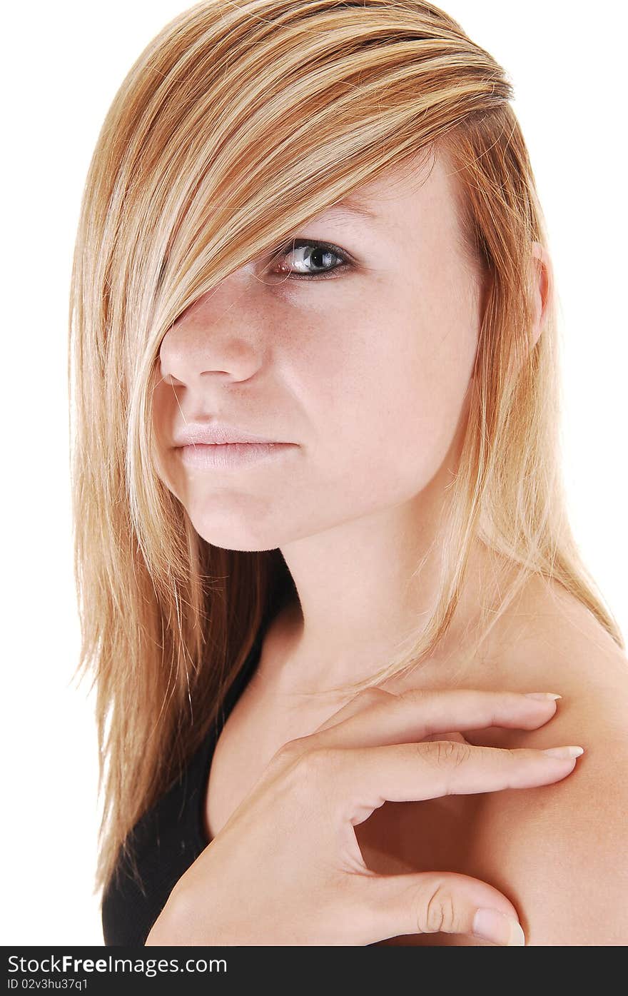 A closeup face shoot of a young blond woman, one eye covert from
her hair, looking into the camera on white background. A closeup face shoot of a young blond woman, one eye covert from
her hair, looking into the camera on white background.
