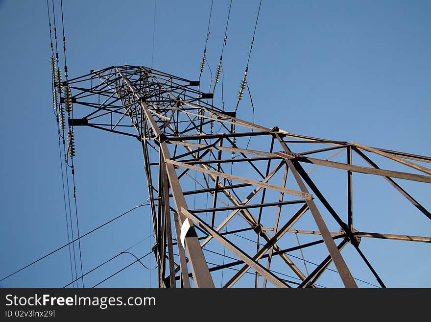 High-voltage power lines against the sky. Industrial background for appropriate purposes