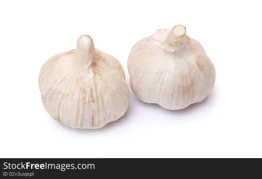 Aromatic, fresh garlic on a white background. Aromatic, fresh garlic on a white background.