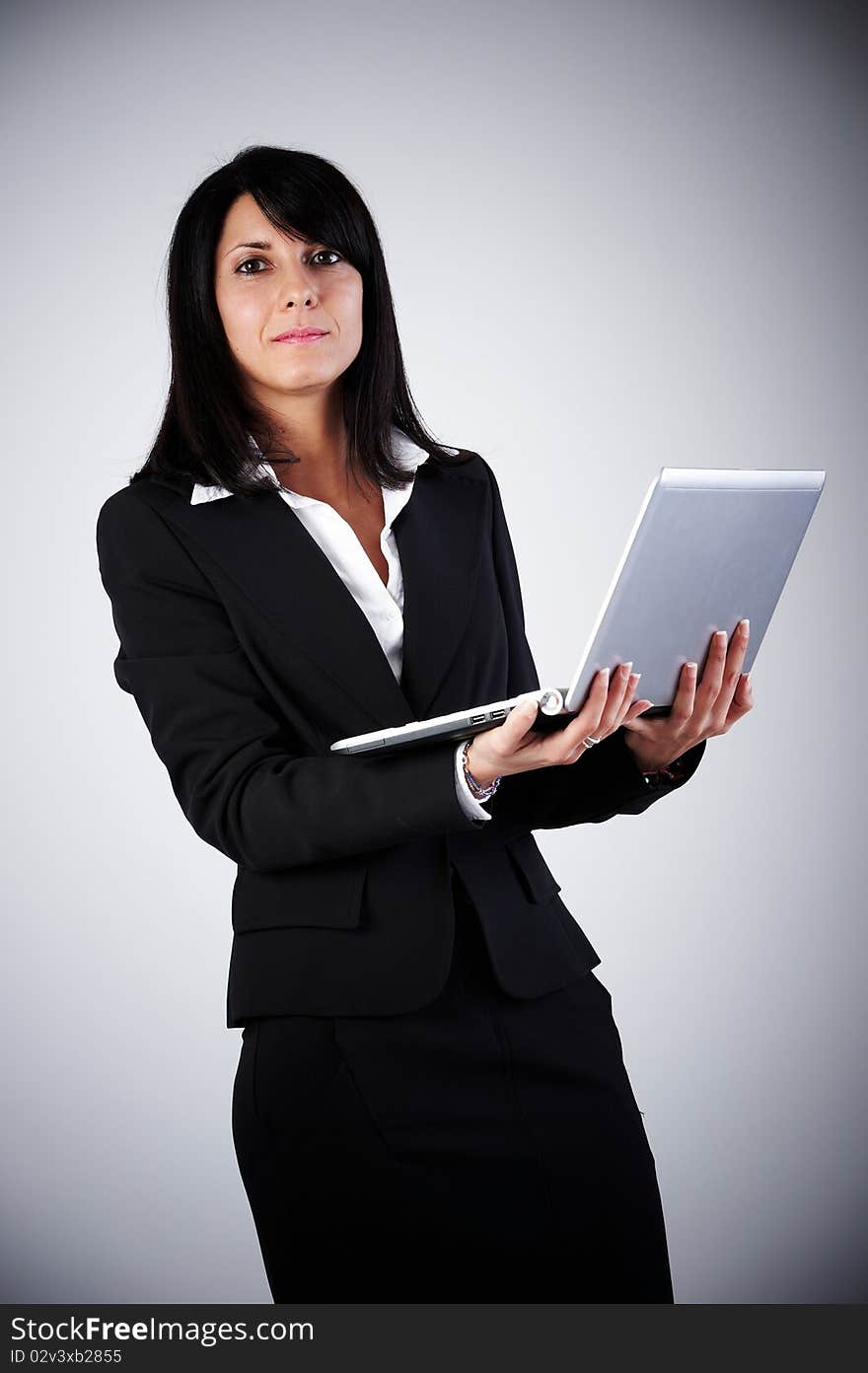 Business Woman on grey background With Laptop. Business Woman on grey background With Laptop