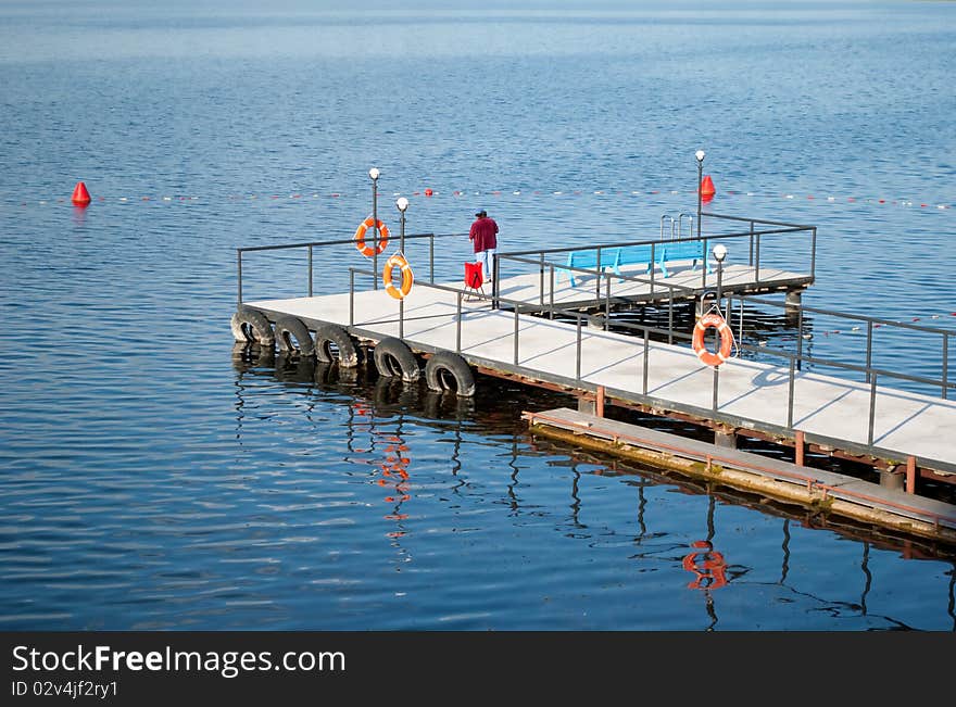 Woman Is Fishing On The Lake