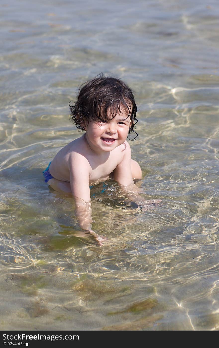 Little kid playing in the water at Black sea, Bulgaria. Little kid playing in the water at Black sea, Bulgaria