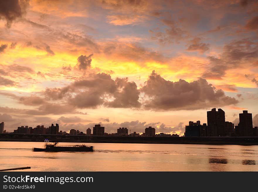 The beautiful sunset at the city near the river