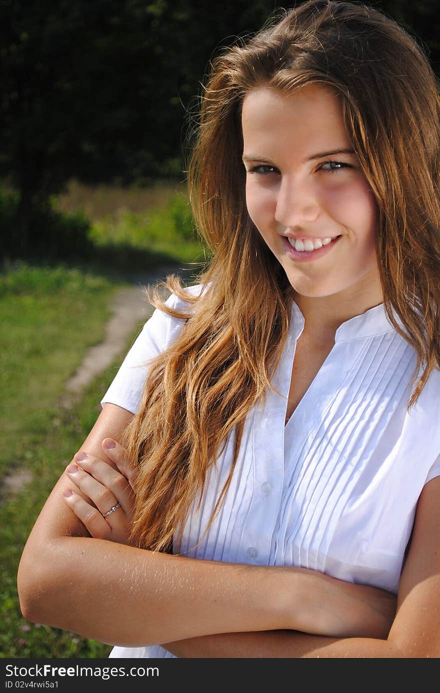 Beautiful student girl is smiling and looking at you