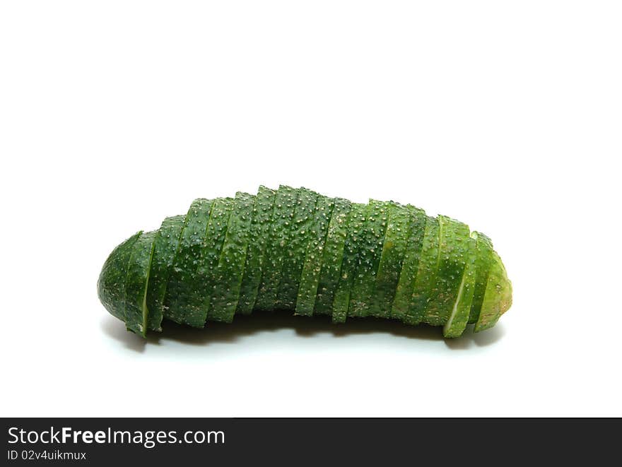 Single sliced cucumber on white background.