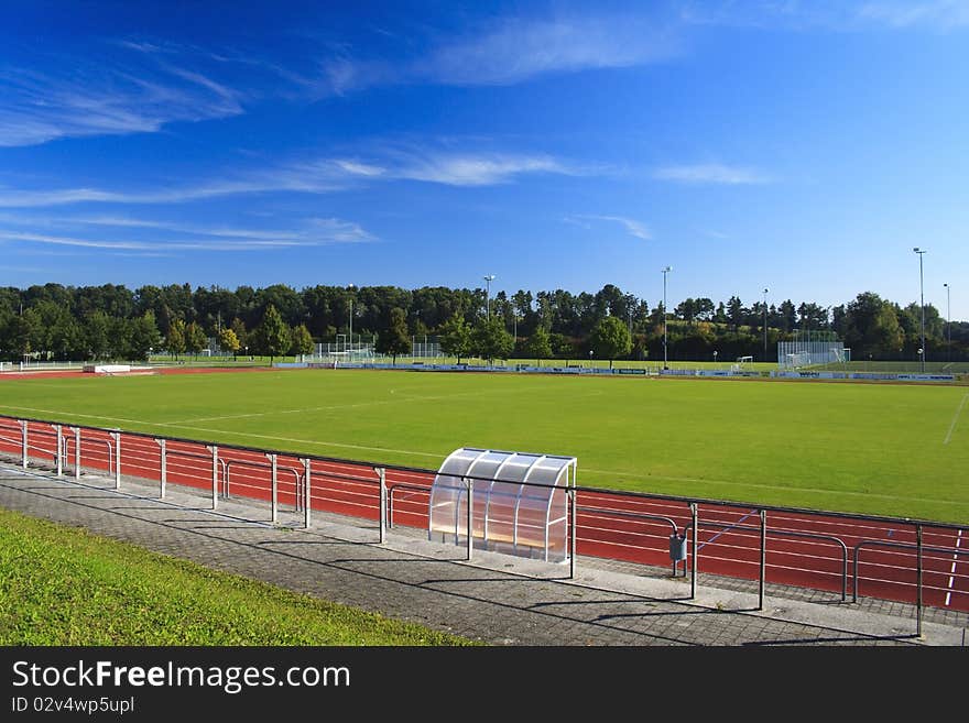 Green football field with red athletic field