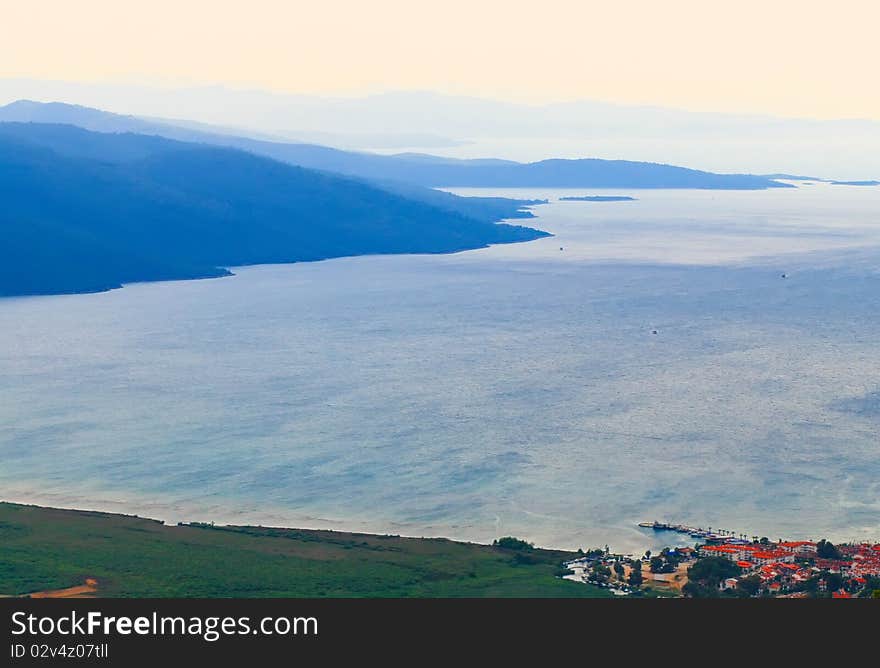 The city by the sea and the mountains in the haze