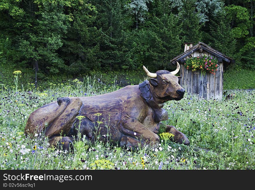 On the way to the Vanoise National Park, a roundabout on the road with wooden figures.