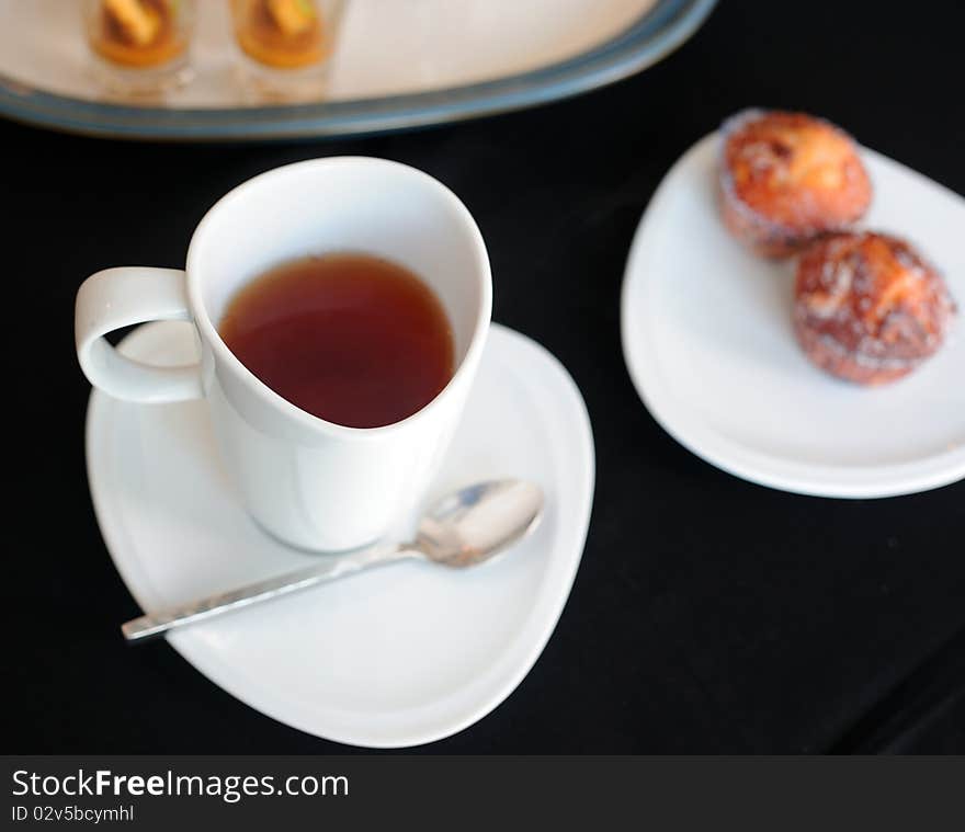 Cup of tea and various cakes