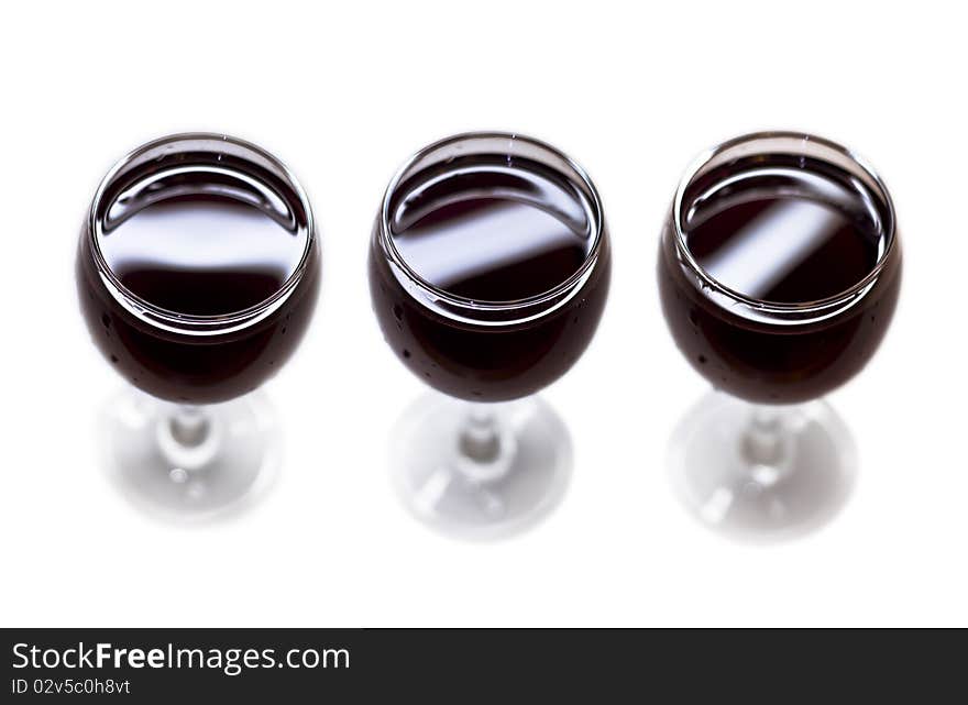 Three glasses of red dry wine. Isolated on white background.