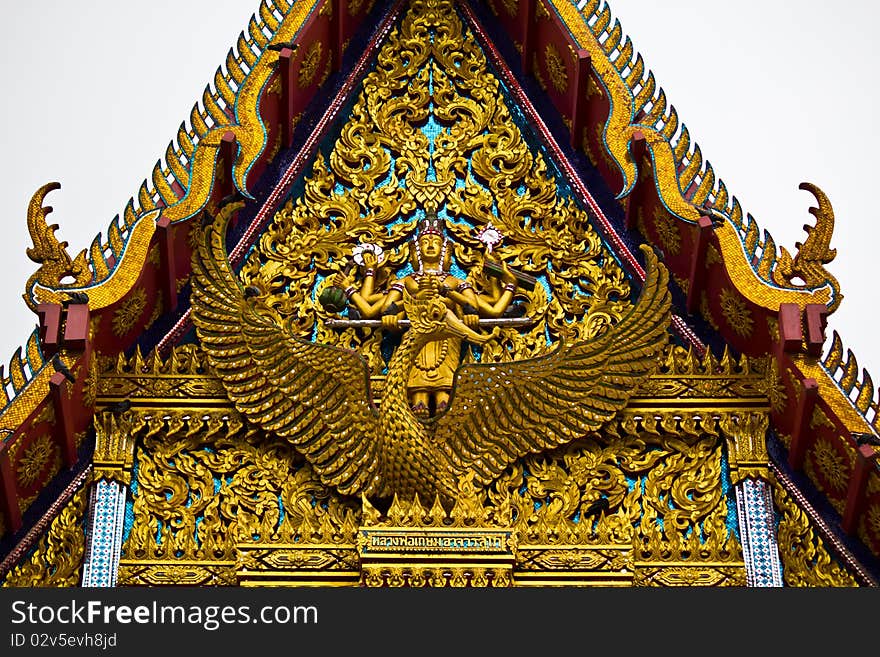 The elongated and elaborately carved apex of the gable in temple