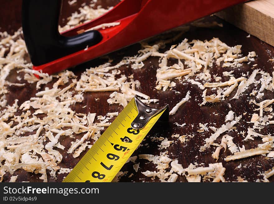 Shavings of wood, brick and red plane