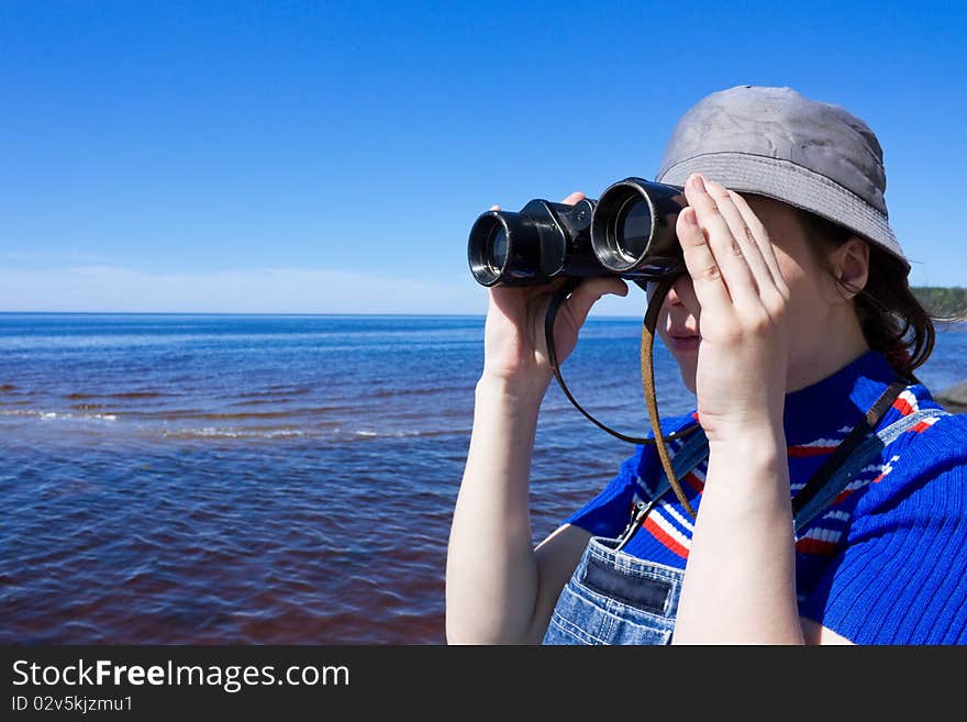 The girl with the binoculars.