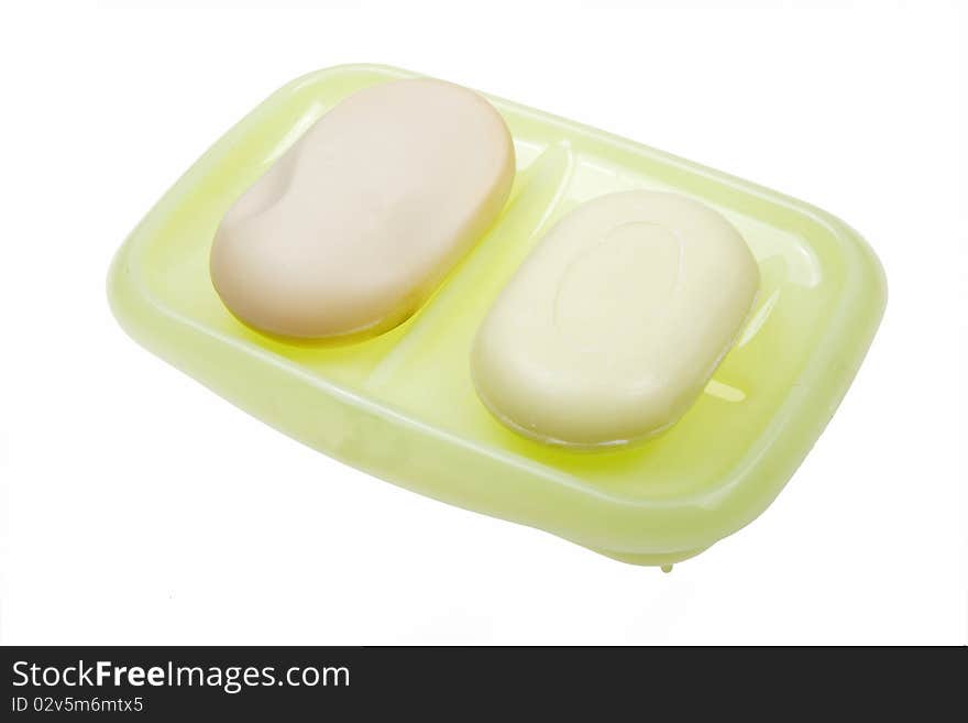 Two scented soaps with rack on white