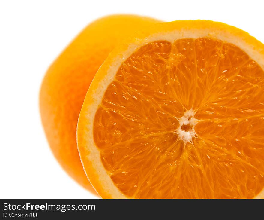 One Half Of Orange With Another Whole Orange