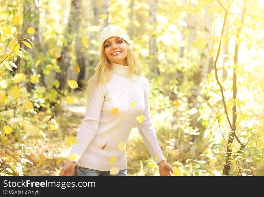 Attractive girl in the autumn forest