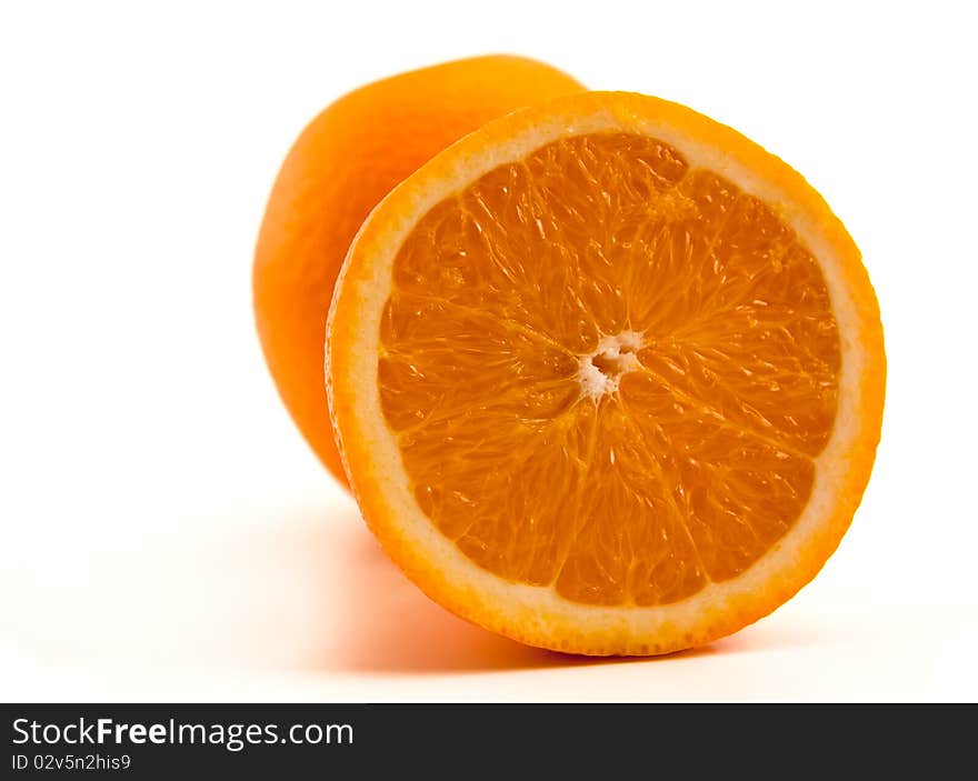 One Half Of Orange With Another Whole Orange.