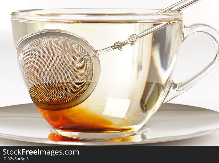 Antioxidant rich healthy herbal rooibos tea from the Western Cape region in South Africa, brewing in a cup. Antioxidant rich healthy herbal rooibos tea from the Western Cape region in South Africa, brewing in a cup.