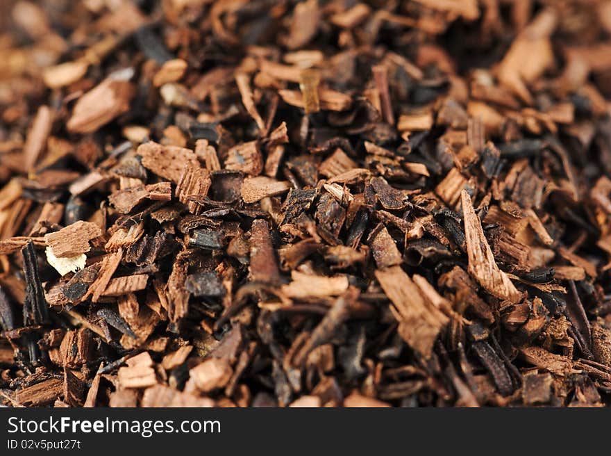 Macro studio shot of dry antioxidant rich healthy herbal rooibos honeybush tea from the Western Cape region in South Africa. Macro studio shot of dry antioxidant rich healthy herbal rooibos honeybush tea from the Western Cape region in South Africa.